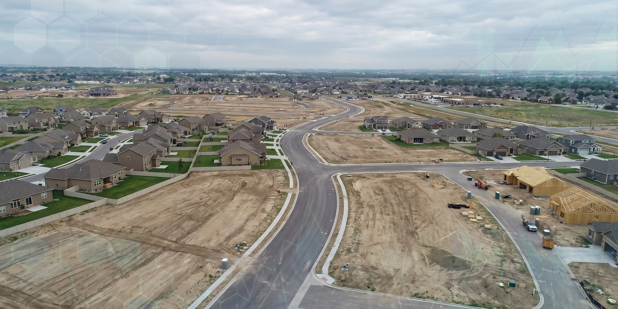 Suburban homes under construction beside mortgage paperwork and zoning maps on a desk
